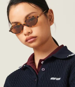 Miu Miu Oval Sunglasses in Light Havana